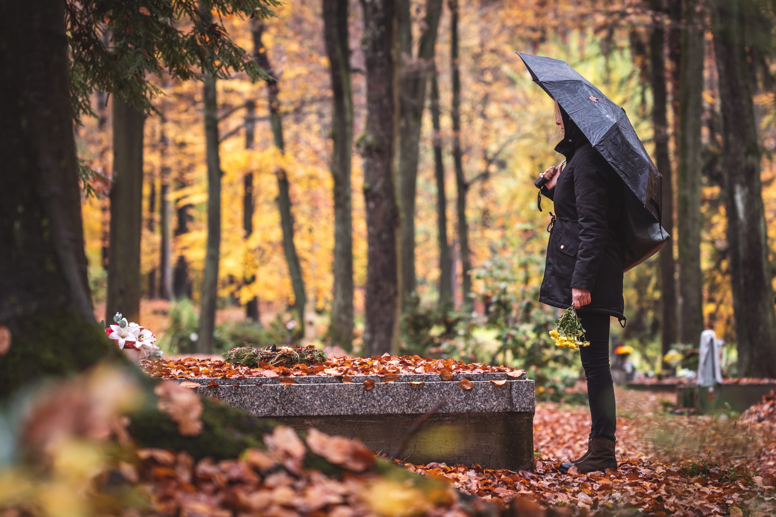 person visiting grave